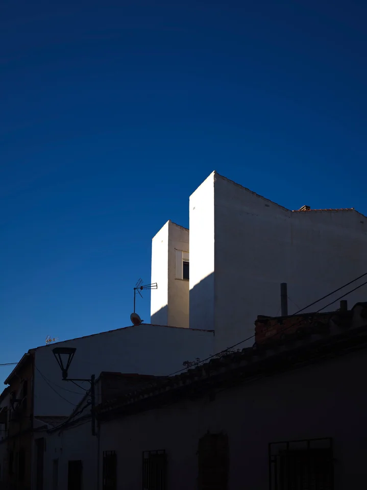 White buildings beneath a deep blue sky